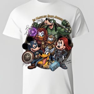 May include: White t-shirt featuring a colorful graphic of Disney characters as Marvel Avengers. Mickey Mouse as Captain America, Goofy as Hulk, and Minnie Mouse as Black Widow are among the characters. The text "The Marvel-ous Disney Avengers" is at the top.