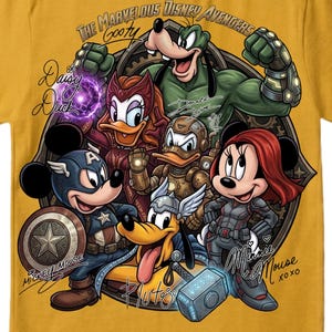 May include: Mustard yellow t-shirt featuring a graphic of Disney characters reimagined as Avengers. Mickey Mouse as Captain America, Minnie Mouse as Black Widow, and Goofy as Hulk are among the characters. Text includes "The Marvelous Disney Avengers" and character names.