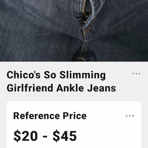 May include: Dark blue denim jeans featuring a gold-toned metal button closure with the text Chico's engraved on the front. The jeans include a zippered fly, belt loops, and visible copper-colored stitching along the seams and pockets.
