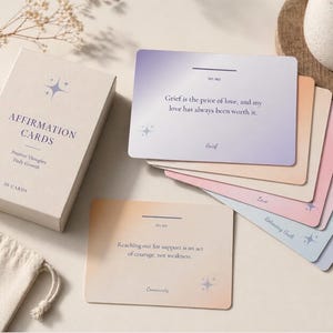 May include: A set of affirmation cards with a box and a small bag. The box reads "Affirmation Cards" and "50 Cards". The cards have inspirational quotes. The bag says "Believe in Yourself".