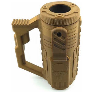 May include: A tan-colored mug with a tactical design. It features a handle, a textured lid, and a skull emblem. The mug has a cylindrical body with vertical ridges and a hinged cover.