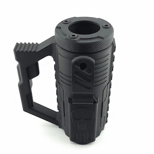 May include: Black tactical-style mug with a textured surface and a large handle. The mug features a skull design and a unique top with multiple holes. The mug is made of a durable material and is designed for rugged use.