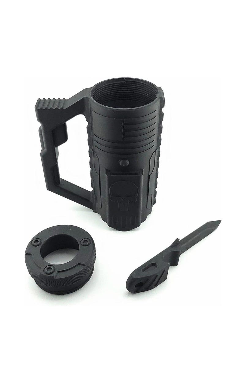 May include: Black tactical mug with a handle, a threaded top, and a skull emblem. Includes a matching black knife and a circular base with screw holes. The mug has a textured surface.