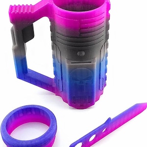 May include: A 3D-printed mug, ring, and knife set with a gradient color scheme of pink, black, and blue. The mug features a handle and a skull design. The ring and knife are also 3D-printed.