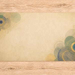 May include: A rectangular desk mat featuring a beige background with overlapping circular patterns in shades of blue, teal, and gold concentrated in the top-left and bottom-right corners, creating a textured and layered visual effect.