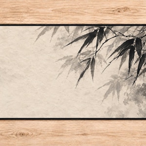 May include: A rectangular desk mat featuring a black ink wash painting of bamboo leaves on a textured, light beige background. The design is oriented toward the upper right corner, with a solid black border framing the entire rectangular surface.