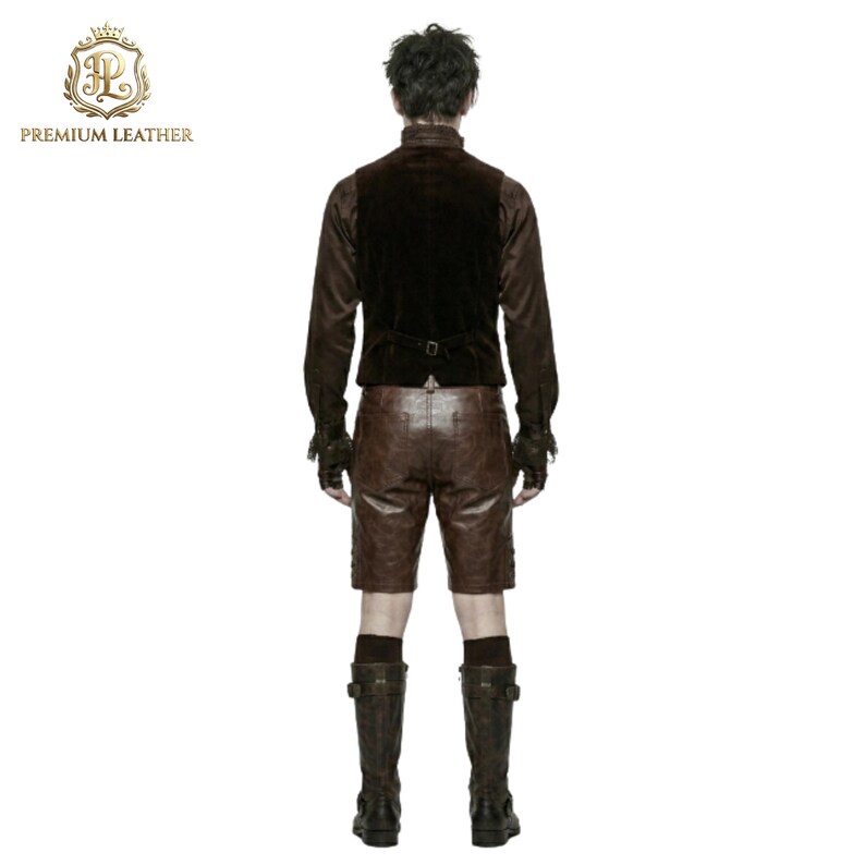 May include: A dark brown velvet vest with a back buckle, a long-sleeved brown shirt with ruffled cuffs, brown leather shorts, and dark brown knee-high boots. The image includes the text PREMIUM LEATHER with a gold crown logo in the top corner.