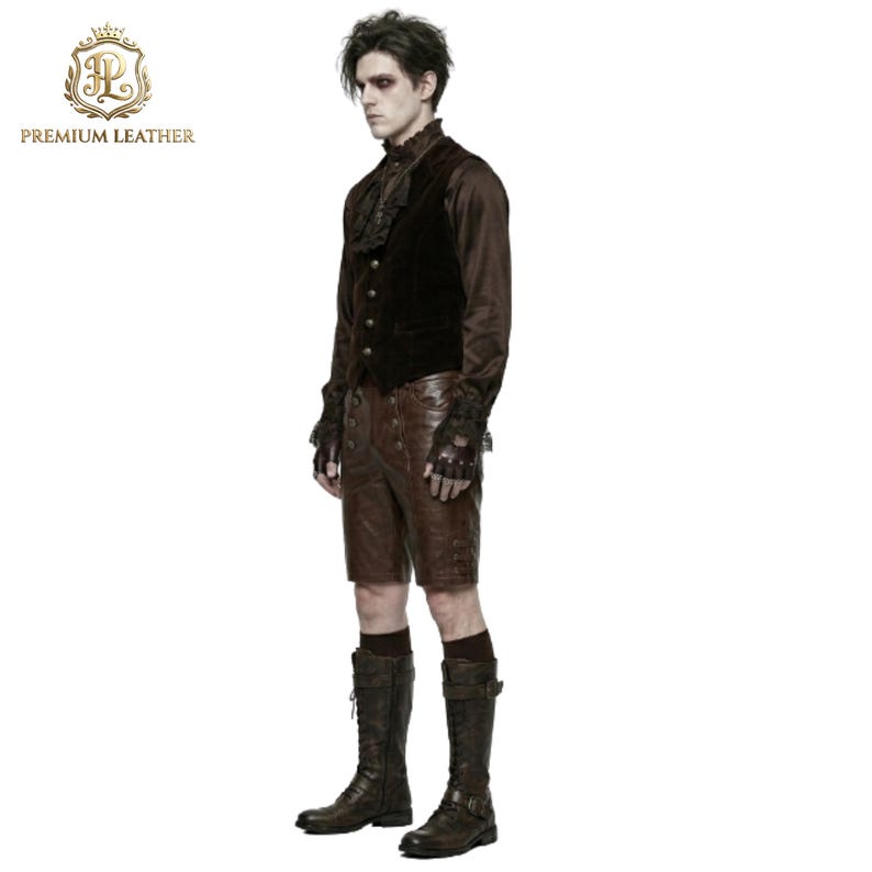 May include: A dark brown velvet vest with gold buttons, a brown long-sleeved shirt with a ruffled collar, brown leather shorts with button details, fingerless gloves, and tall brown lace-up boots. The outfit is worn by a person with dark hair.