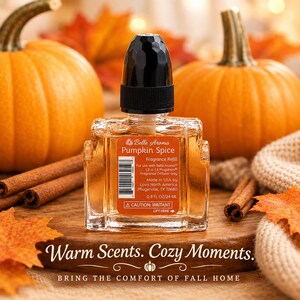 May include: A clear glass fragrance refill bottle with a black faceted cap and an orange label reading Belle Aroma Pumpkin Spice, 0.8 FL OZ/24 ML. The label includes a barcode, caution text, and instructions for use with L2 or L3 Plugables.