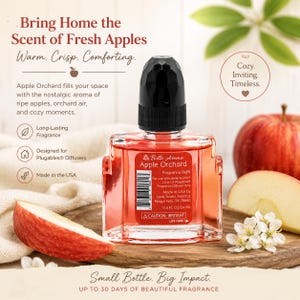 May include: A Belle Aroma Apple Orchard fragrance refill bottle with a black cap, containing 0.6 fl oz of red liquid. The label features text including 'Apple Orchard', 'Fragrance Refill', and 'Made in the USA' with a barcode and caution warning.