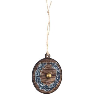 May include: A wooden Christmas ornament shaped like a shield with two blue dragons facing each other. The shield has a wood grain pattern and a gold metal accent in the center.