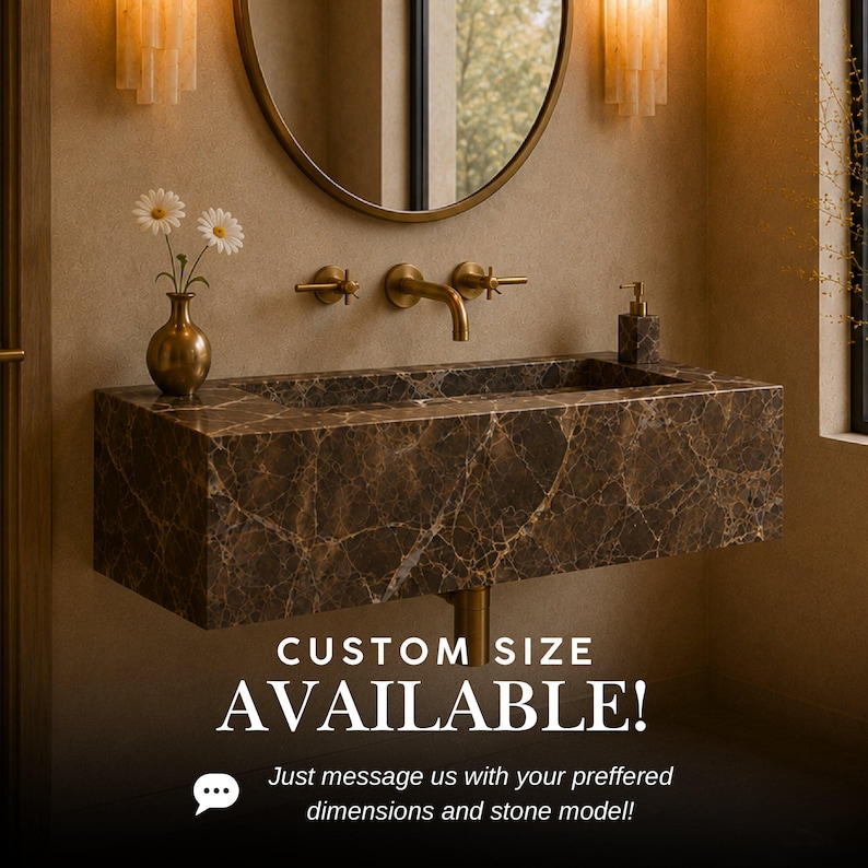 May include: A wall-mounted rectangular bathroom sink crafted from dark brown marble with prominent white veining. It features a brass faucet with two cross-handle controls, a brass vase with two white daisies, and a soap dispenser. Text reads: CUSTOM SIZE AVAILABLE! Just message us with your preferred dimensions and stone model!