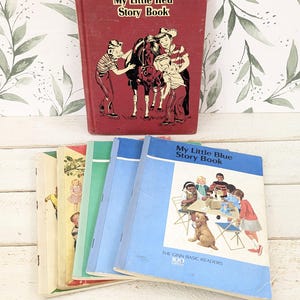 May include: A collection of vintage children's books including a hardbound My Little Red Story Book with a horse illustration and several softcover Ginn Basic Readers, including My Little Blue Story Book featuring a group of children and a dog.