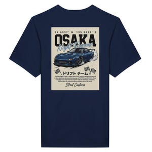 May include: Navy blue t-shirt featuring a graphic of a blue sports car with the text "OSAKA Night Runner". The design includes Japanese text and checkered flags, with the words "Street Customs" at the bottom.