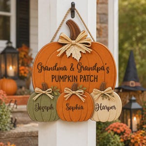 May include: A wooden pumpkin-shaped wall sign featuring the text Grandma & Grandpa's PUMPKIN PATCH. Three smaller pumpkins are attached below, labeled Joseph, Sophia, and Harper. The sign is decorated with tan raffia bows and a rope hanger.