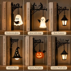 May include: A collection of six decorative bookends featuring black metal wall-mount style brackets with hanging light fixtures. Designs include a ghost reading a book, a winged ghost, a classic lantern, a witch hat, a jack-o'-lantern, and a lantern with a spiderweb.
