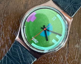 Vintage 1990 Swatch Johnny Guitar nun 34 mm Herren Armbanduhr Grünes Lederband Metallkappe Originale Swiss Made Quarz Armbanduhr
