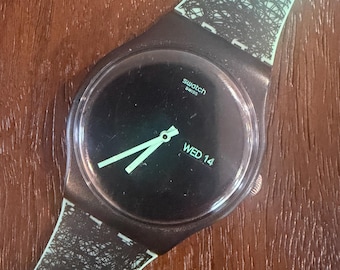 Stoffmuster Wonder Flora SUOZ704 Neu Herren 41 mm | Anne-Flore Marxer Design | Türkis Armband, Schwarzes Gehäuse, Wochentag/Datum | Exzellenter Zustand