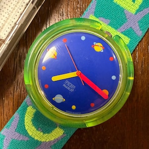 1990 Pop Swatch Moondancer PWJ101 Neon Green Case Blue Planets Space Dial Textile Strap 39mm New Old Stock Box Papers Working
