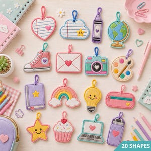 May include: A collection of twenty embroidered patches featuring various shapes including a heart, cloud, crayon, globe, sneaker, envelope, camera, paint palette, book, rainbow, lightbulb, pencil case, star, cupcake, laptop, and water bottle.