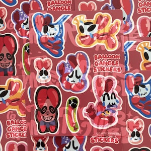 Op de afbeelding: Een stickervel met meerdere cartoonfiguren gemaakt van rode, blauwe en gele ballonvormen. De ontwerpen bevatten diverse expressieve gezichten, sommige met tranen, en de tekst BALLOON GANGLE STICKERS in het wit op een donkerrode achtergrond.