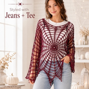 May include: A dark red crochet top featuring a spiderweb pattern with long sleeves and a pointed hemline. The garment is worn over a plain white t-shirt and light blue denim jeans. Text on the image reads: Styled with Jeans + Tee.