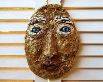 wall face ceramics handmade mask sculpture.