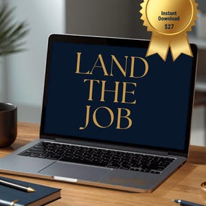 May include: A silver laptop shows the words "LAND THE JOB" in gold on a dark blue screen. A gold seal with a ribbon that says "Instant Download" is attached to the laptop. A notebook, pen, and mug are on the wooden desk.