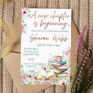 May include: A rectangular bridal shower invitation card featuring floral accents and a stack of books with a mug. The text reads: A new chapter is beginning, Please join us for a bridal shower honouring Sharon Webb, April 16th 2026 at 3pm, The Book Room, 12 Sunday Street, Sydney NSW 2000, rsvp, Lindsay by 1st April 0400000000.