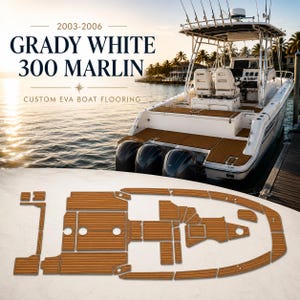 May include: A white Grady White 300 Marlin boat with custom EVA boat flooring. The boat is docked near a wooden pier. The flooring is a light brown color and is cut into various shapes to fit the boat's deck.