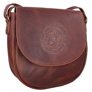 May include: A brown leather shoulder bag with a Celtic knot design embossed on the front. The bag has a flap closure and a long adjustable strap.