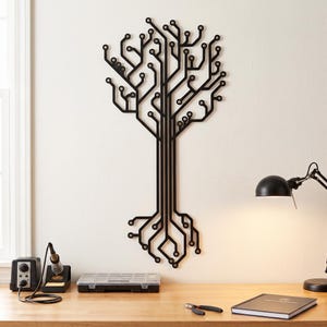 May include: A black wall-mounted sculpture shaped like a tree, constructed from interconnected lines and circular nodes that mimic the appearance of a printed circuit board. The design features a central trunk that branches out into a complex network.