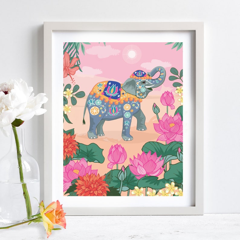 May include: A colorful illustration of an elephant decorated with floral patterns and jewels, standing in a field of pink lotus flowers. The elephant is wearing a traditional Indian headdress and a colorful saddle.