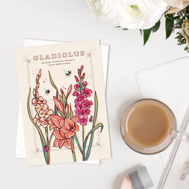 May include: A card with a vintage illustration of gladiolus flowers in pink, orange, and white. The card has the text "Gladiolus" and "Meaning: Strength & Integrity, August Birth Flower".
