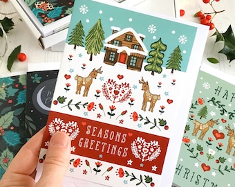 Christmas Card Lodges In the Snow in a Scandinavian Folk Style