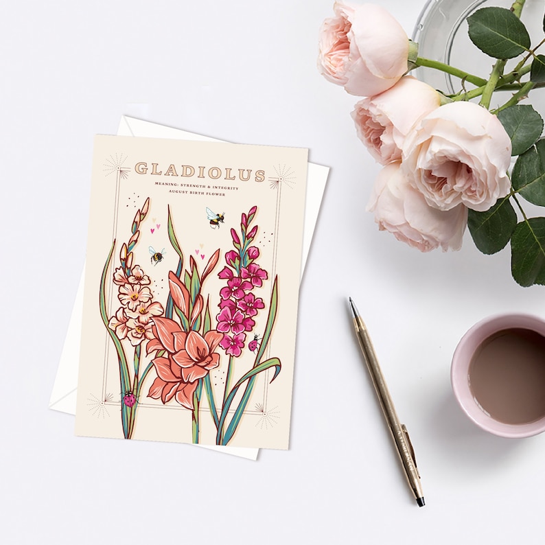 May include: A card with a vintage illustration of gladiolus flowers in shades of pink, peach, and white. The card has the text "Gladiolus" in a retro font and the words "Meaning: Strength & Integrity, August Birth Flower".