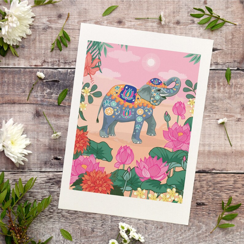 May include: A colorful illustration of an elephant decorated with floral patterns and jewels, standing in a field of pink and white flowers. The elephant is surrounded by lush green foliage and a pink sky.