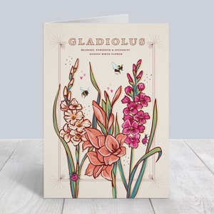 May include: A card with an illustration of pink, white, and orange gladiolus flowers with bees and ladybugs. The text on the card reads "Gladiolus, Meaning: Strength & Integrity, August Birth Flower."