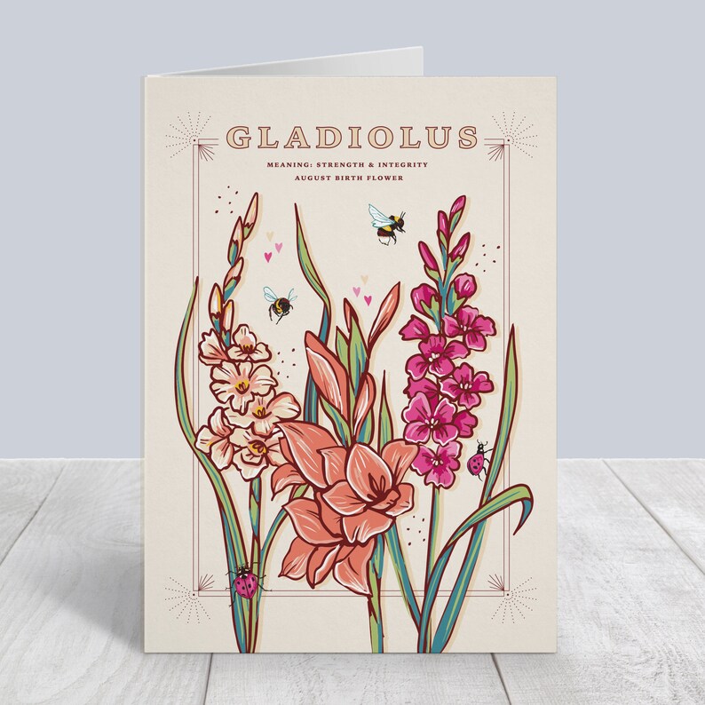 May include: A card with an illustration of pink, white, and orange gladiolus flowers with bees and ladybugs. The text on the card reads "Gladiolus, Meaning: Strength & Integrity, August Birth Flower."