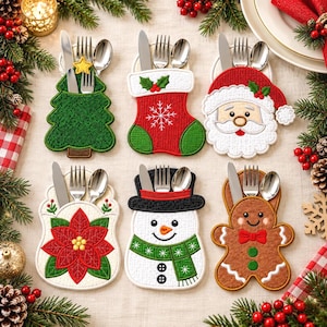 May include: Six fabric cutlery holders shaped like a Christmas tree, stocking, Santa Claus, poinsettia, snowman, and gingerbread person. Each holder contains a silver knife, fork, and spoon. The designs feature embroidered details in red, green, white, and brown.