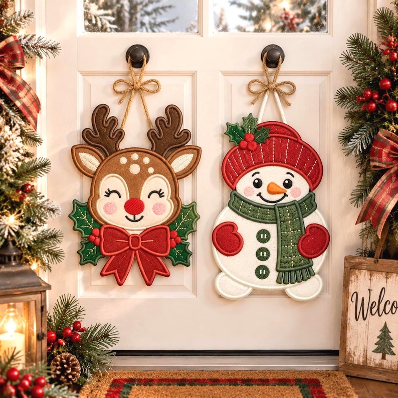 May include: Two hanging holiday decorations on a white door. One is a brown reindeer with a red nose, green holly leaves, and a large red bow. The other is a white snowman wearing a red hat, a green scarf, and red mittens, both with twine.