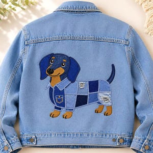 May include: A light blue denim jacket featuring a large embroidered patch on the back. The patch depicts a brown and black dachshund dog wearing a patchwork denim shirt with visible stitching, a small pocket, and distressed fabric details.