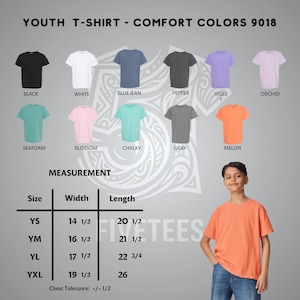 May include: Youth T-shirt Comfort Colors 9018 color chart featuring black, white, blue jean, pepper, violet, orchid, seafoam, blossom, chalky, gray, and melon shirts. Includes a measurement table with width and length in inches for sizes YS to YXL.