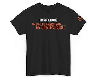 May include: A black short-sleeved t-shirt featuring the white and orange text I'M NOT ARGUING I'M JUST EXPLAINING WHY MY DRIVER'S RIGHT printed on the chest. A small circular orange and black logo is visible on the upper right sleeve area.