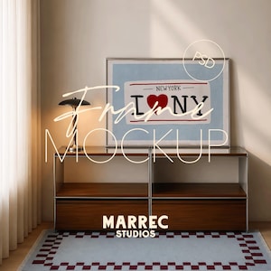 May include: A rectangular picture frame containing a print with the text NEW YORK and a red heart symbol between the letters I and NY. The frame sits on a two-part wooden console table with a metal lamp beside it and a checkered rug on the floor.