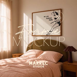 May include: A bedroom scene featuring a framed artwork with a black and white illustration of a woman with the text "NO USE RUNNIN' AWAY". The bed has pink bedding, a green headboard, and a wooden nightstand with a lamp.