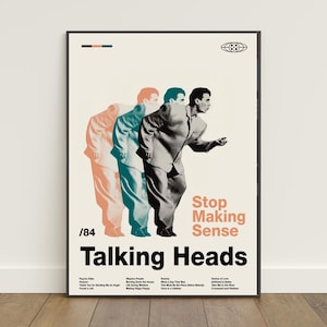 May include: A framed poster featuring a triple-exposure graphic of a person in a suit, with the text Stop Making Sense, Talking Heads, and /84. The design includes a tracklist in black text on a cream background with peach and teal color accents.