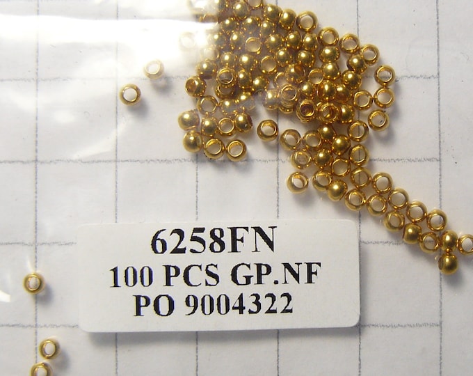 11 bags of 100 Crimp gold-plated brass beads, 2.5 mm round, 1.5 mm inside. (b51841)