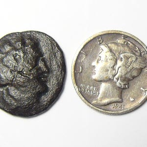 Ancient Greek coin, electronically cleaned for jewelry or gift, Bronze (17-18.5) x (2-3) mm, 3.9 g.  Unidentified. (c12)