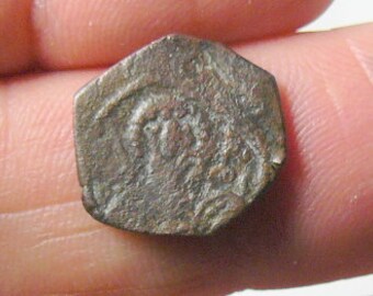 Ancient Byzantine coin, Manuel I, Comnenus. 1143-1180 AD.  1/2 Tetarteron,  1.8 grams. 16 mm (c5621)